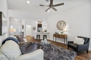 living room featuring hardwood / wood-style flooring and ceiling fan