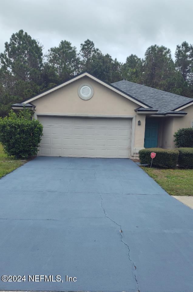 single story home with a garage