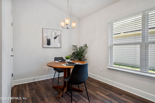 dining area featuring an inviting chandelier, plenty of natural light, and dark hardwood / wood-style flooring