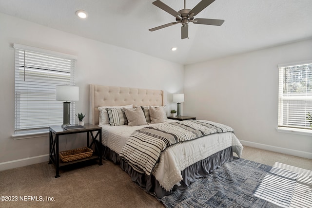 bedroom with ceiling fan and carpet floors