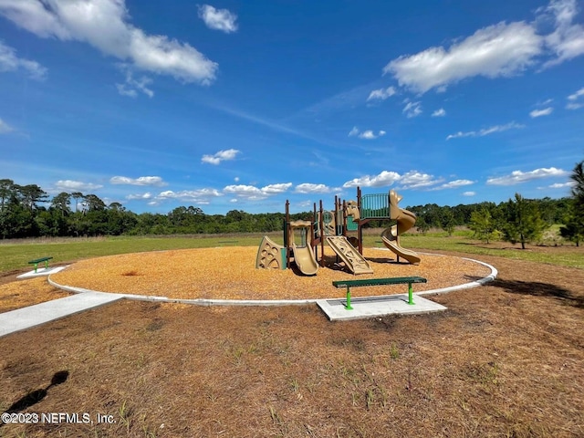 view of jungle gym featuring a yard