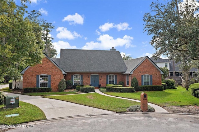 view of front of property with a front lawn