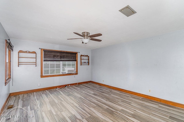 empty room featuring ceiling fan and light wood-type flooring