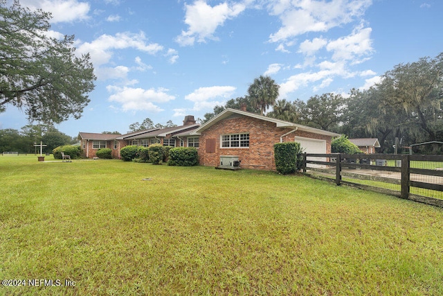 view of yard with a garage