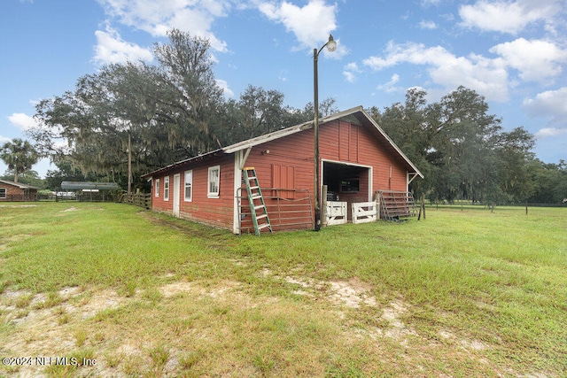 view of outdoor structure featuring a yard