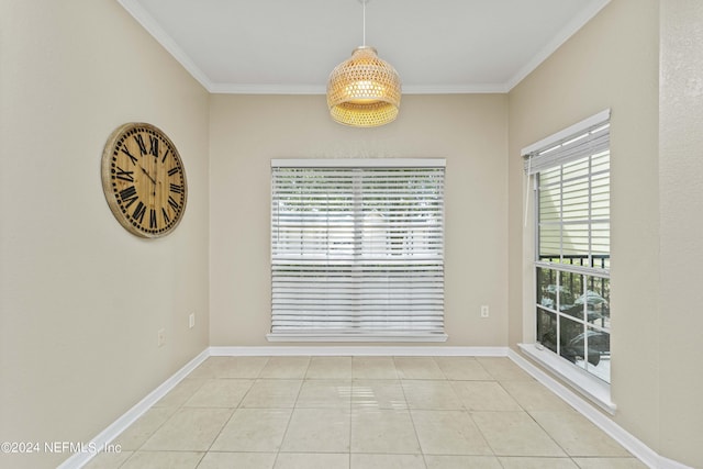unfurnished dining area featuring crown molding, baseboards, and tile patterned floors