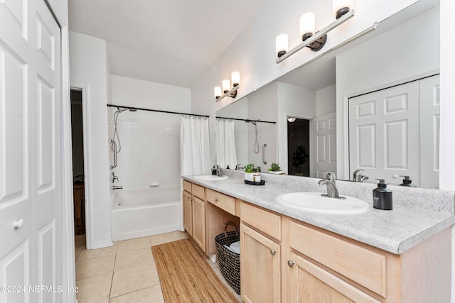 bathroom featuring tile patterned floors, shower / bath combo, and vanity