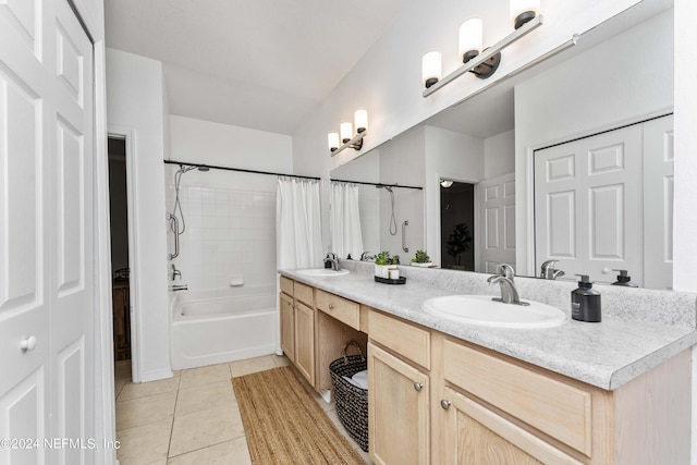 full bathroom featuring shower / tub combo, tile patterned floors, a sink, and double vanity