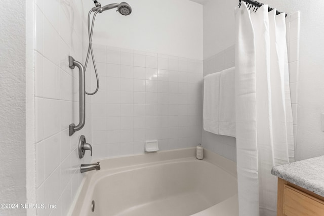 bathroom with shower / bath combination with curtain and vanity
