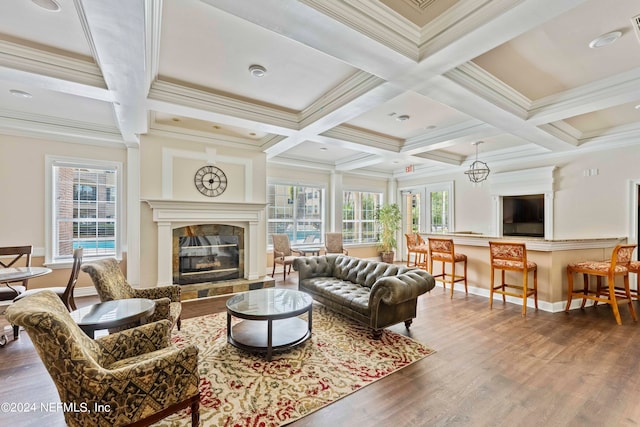 living room with plenty of natural light, coffered ceiling, beam ceiling, and dark hardwood / wood-style flooring