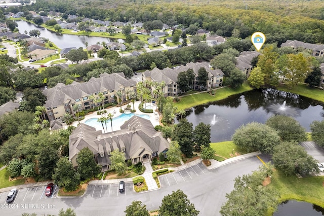bird's eye view with a residential view and a water view