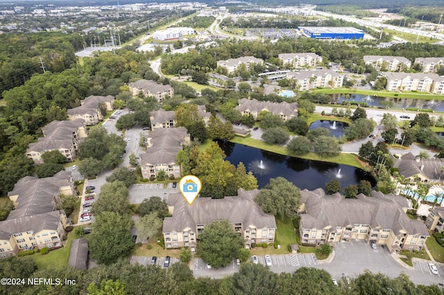 aerial view with a water view and a residential view