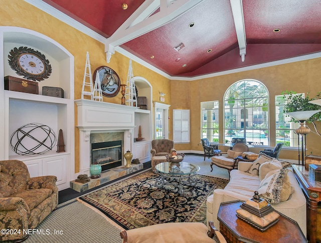 living room with ornamental molding, lofted ceiling with beams, and a textured ceiling