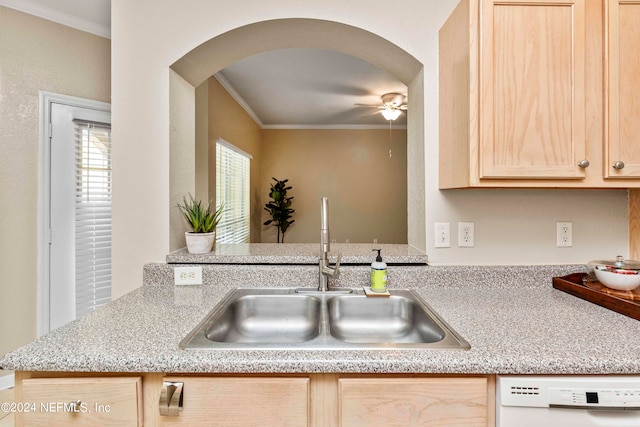 kitchen with ceiling fan, sink, ornamental molding, white dishwasher, and light brown cabinetry