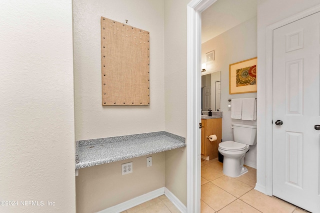 bathroom featuring tile patterned flooring and toilet