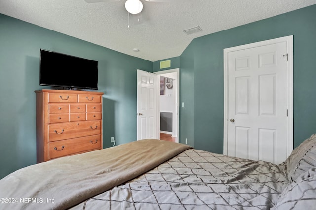 bedroom featuring a textured ceiling and ceiling fan