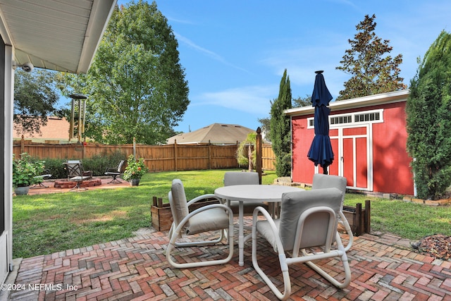 view of patio / terrace featuring a shed and a fire pit