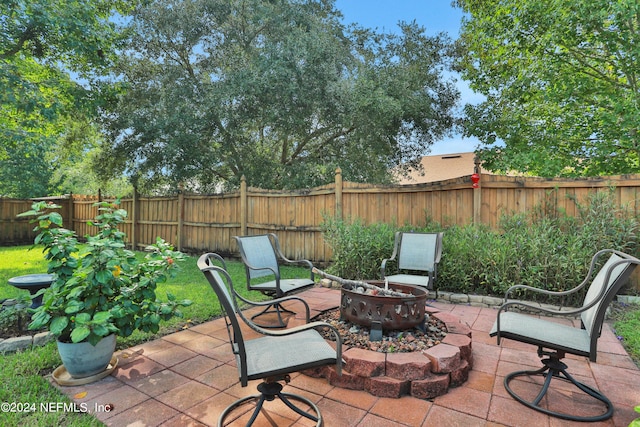 view of patio / terrace with a fire pit