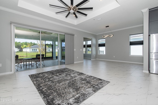 living room with ceiling fan, crown molding, and a tray ceiling