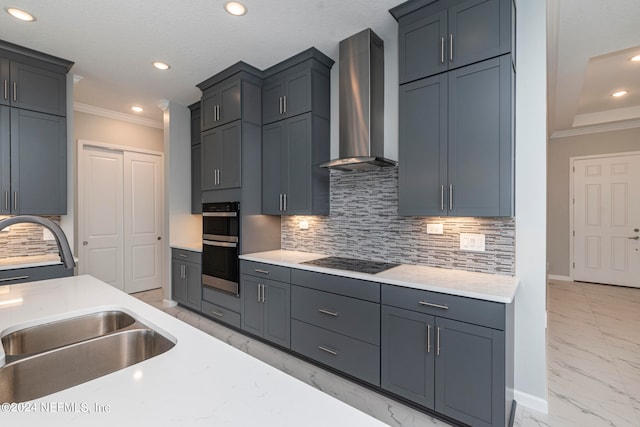 kitchen with black electric cooktop, sink, wall chimney exhaust hood, double oven, and decorative backsplash