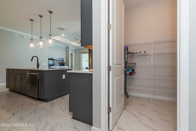 kitchen featuring sink, ornamental molding, an island with sink, pendant lighting, and dishwasher