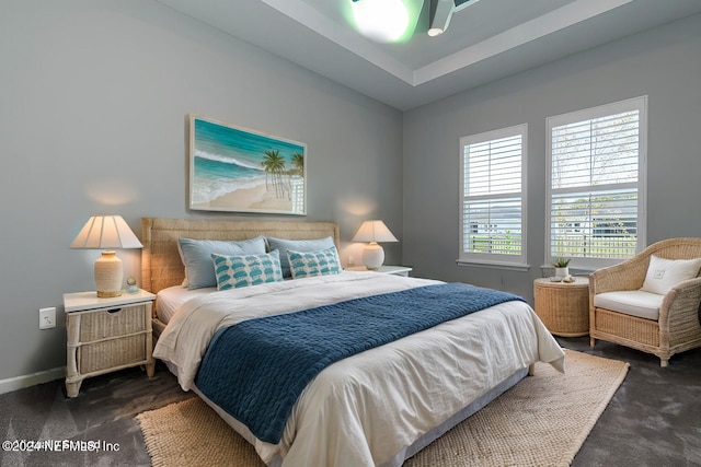 bedroom featuring dark carpet