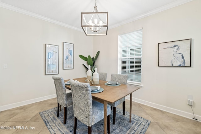 dining space featuring light tile patterned floors, a notable chandelier, and ornamental molding