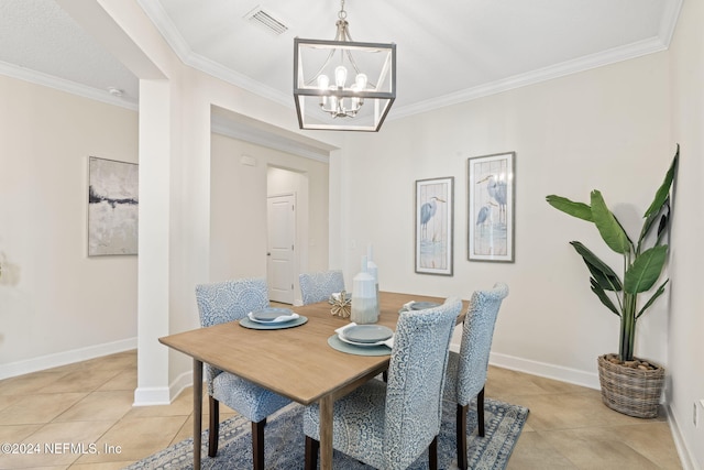 tiled dining space featuring crown molding and an inviting chandelier