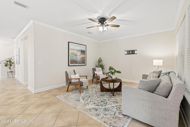 living room with ceiling fan, light tile patterned flooring, and ornamental molding