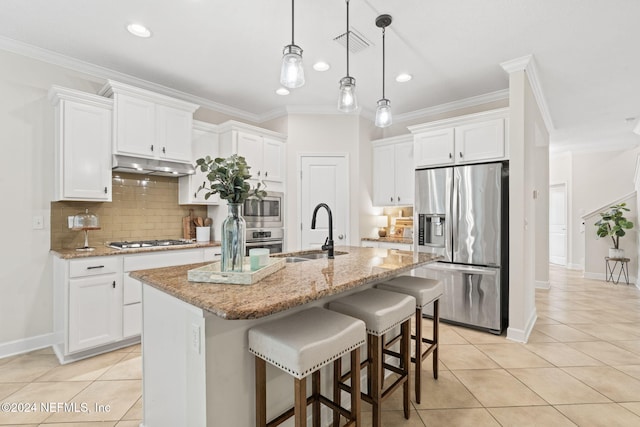 kitchen with a kitchen island with sink, white cabinetry, sink, and stainless steel appliances