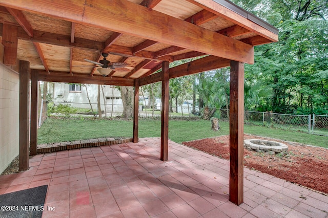 view of patio / terrace featuring ceiling fan and a fire pit