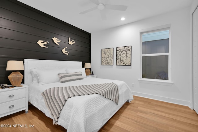 bedroom with light wood-type flooring and ceiling fan