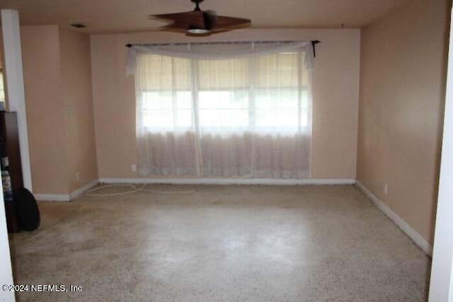 empty room with light carpet and ceiling fan