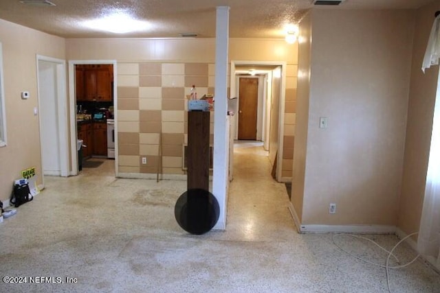 interior space featuring a textured ceiling