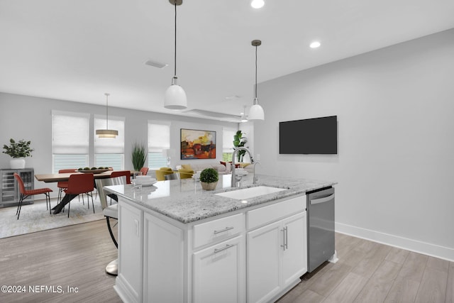 kitchen featuring white cabinets, an island with sink, sink, light hardwood / wood-style flooring, and dishwasher