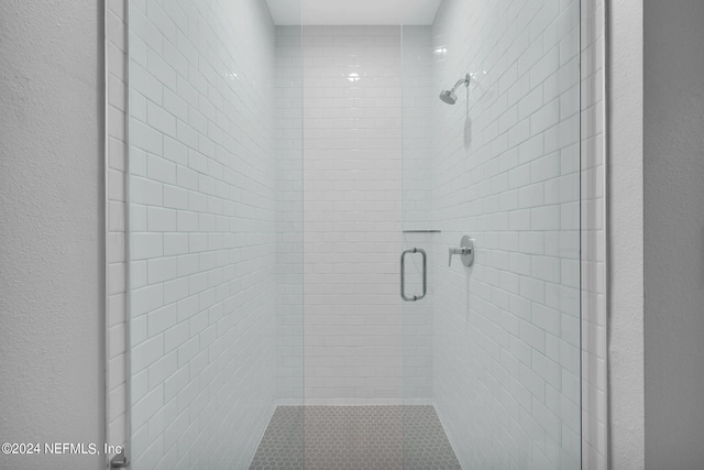 bathroom featuring an enclosed shower