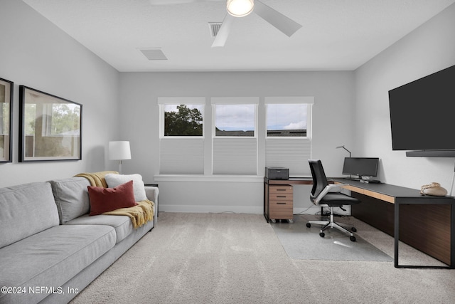 carpeted office featuring a healthy amount of sunlight and ceiling fan