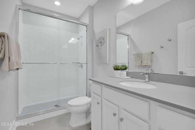 bathroom featuring walk in shower, vanity, and toilet