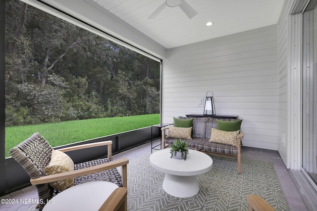 sunroom featuring ceiling fan