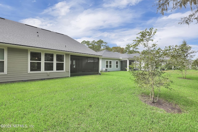 view of yard with a sunroom