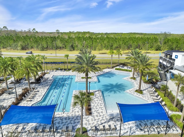 view of swimming pool featuring a patio area