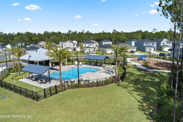 view of swimming pool with a lawn, a gazebo, a patio area, and a playground