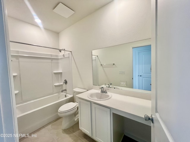 full bathroom featuring tile patterned floors, toilet, vanity, and bathing tub / shower combination