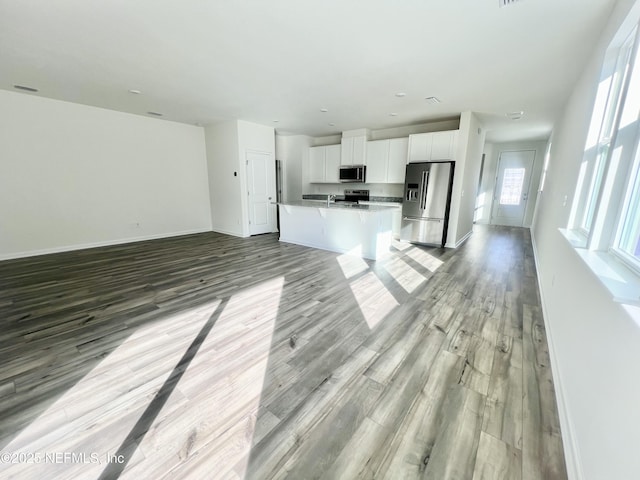 unfurnished living room featuring light hardwood / wood-style floors