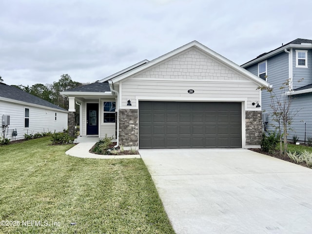 view of front of home with a front yard and a garage