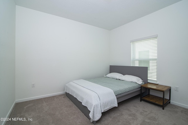 bedroom featuring carpet flooring