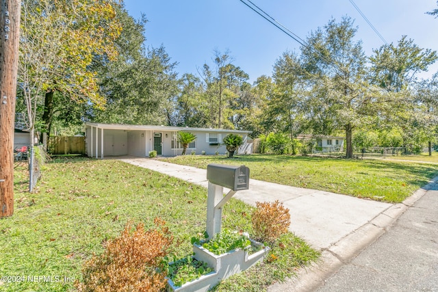 single story home featuring a front lawn