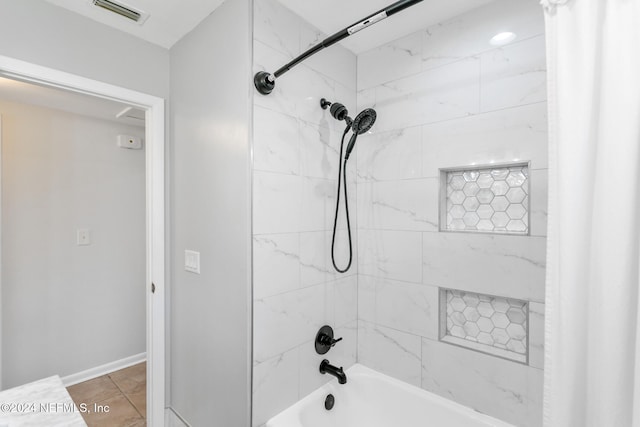 bathroom with tile patterned flooring and shower / bathtub combination with curtain