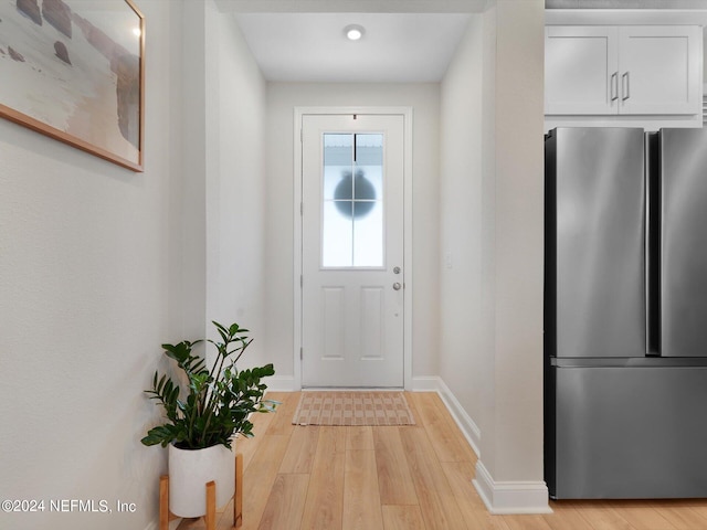 entryway with light hardwood / wood-style flooring