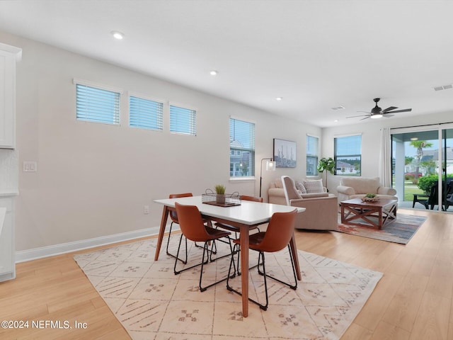 dining space featuring light hardwood / wood-style flooring and ceiling fan